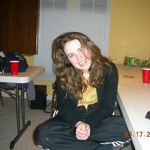 Adidas black pants cross legged