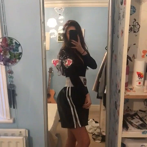 Black shiny boxing shorts with a white waist band and double.mp4