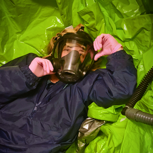 nylon rainsuit and a pile of hazmat suits