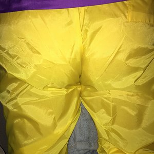 yellow wind pants and purple Columbia packable jacket