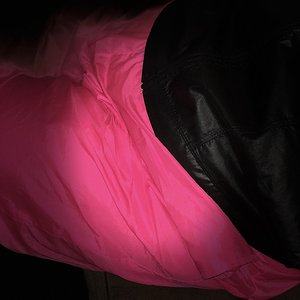 hot pink wind pants and shiny black windbreaker