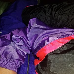 Our swishy suits in bed for some fun nylon action