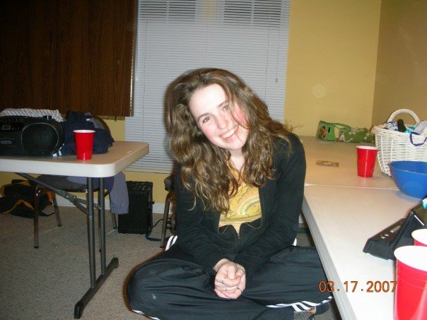 Adidas black pants cross legged