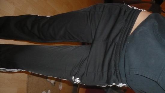 Adidas black pants side angle stand