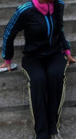 Adidas womans black pants with gold stripes black top with light blue stripes