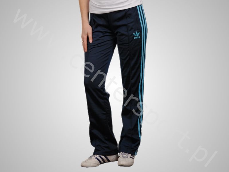 Adidas womans pants with light blue stripes knee pose
