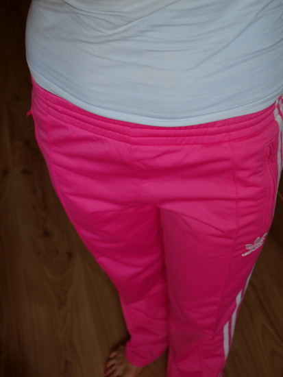 Adidas womans pink pants with white stripe grey top high angle shot front