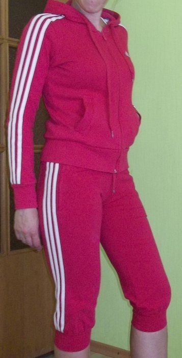 Adidas womans red track suit side pocket pose side lean