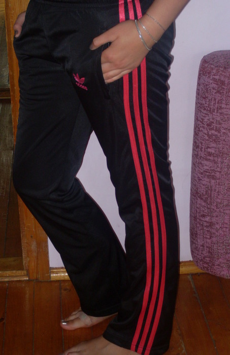 Adidas womans shiny black pants with red trim side