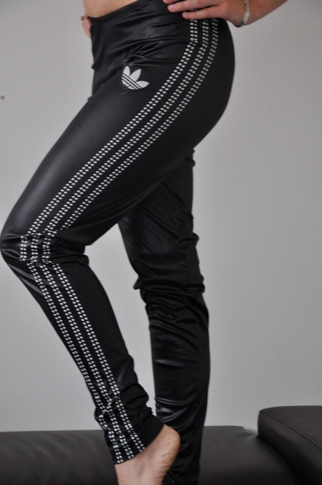 Adidas womans tight shiny black pants with white stripes small logo other side