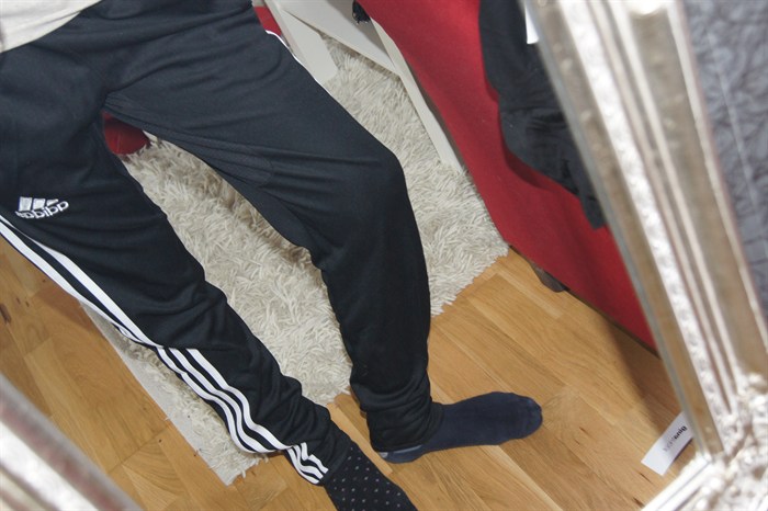 Adidas womens black pants tilted angle down shot