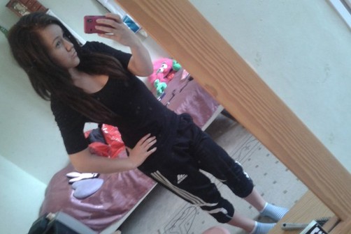 Adidas womens black pants with white trim front tilted shot