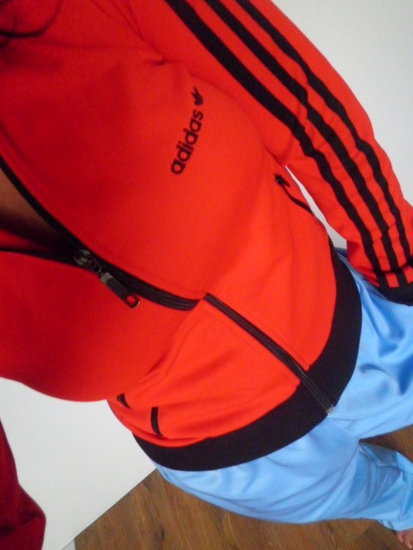 Adidas womens red sporty jacket angle