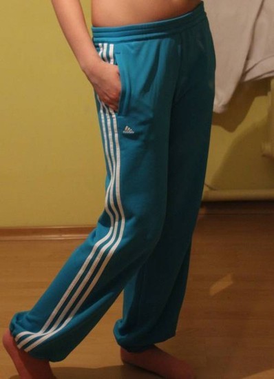 Adidas womens teal pants white stripes leg pose