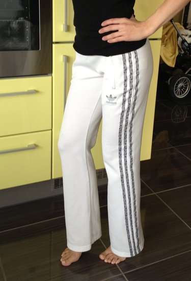 Adidas womens white pants black stripes front pose