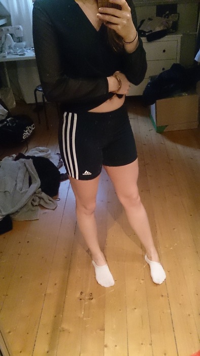 Athletic girl in Adidas shorts