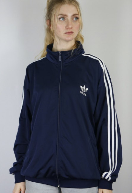 blonde in navy adidas firebird jacket