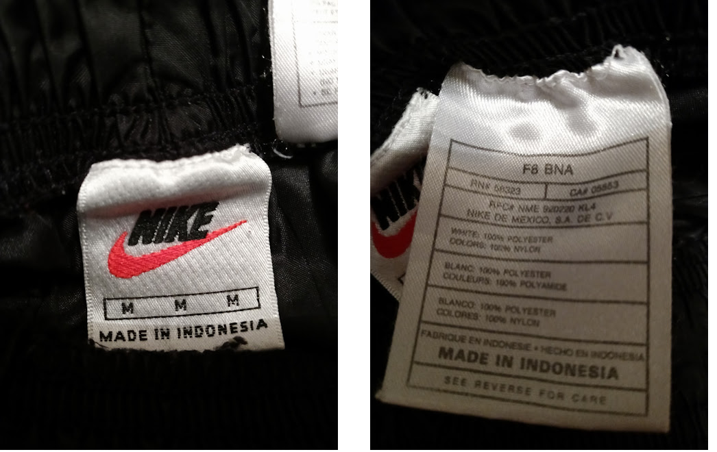 Both frontal tags of my Medium Black Nike Nylon Unlined Pajama Snap-on Pants.png