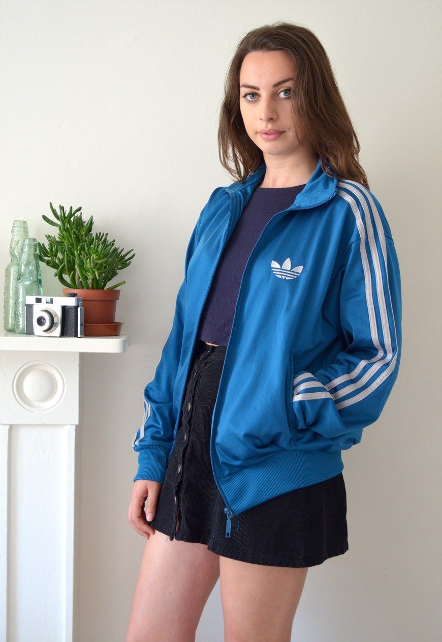 brunette in blue adidas firebird