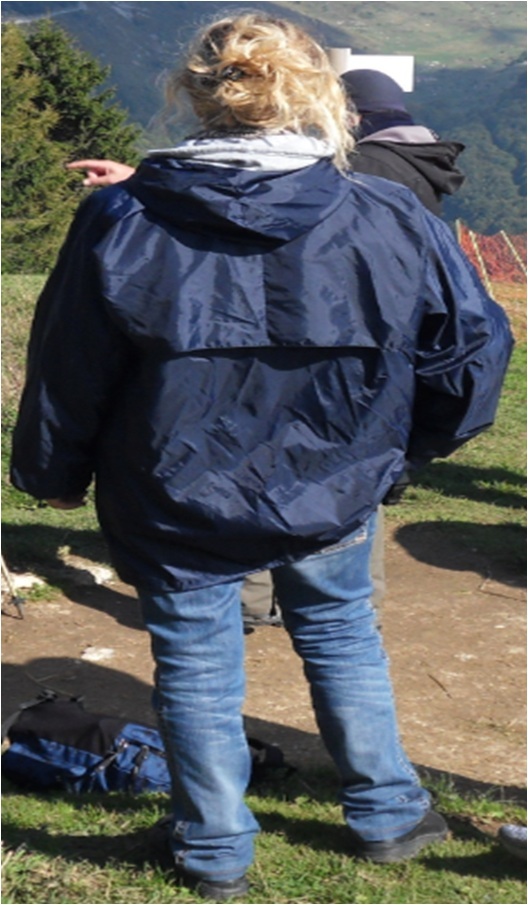 Emma wearing a blue raincoat