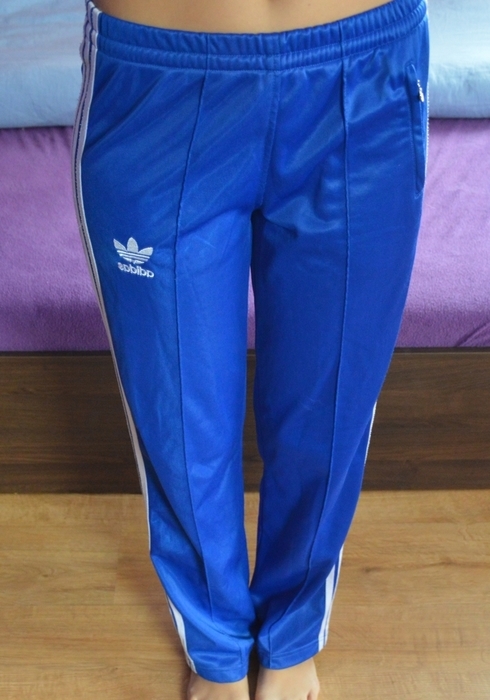 Girl in Adidas blue/white pants