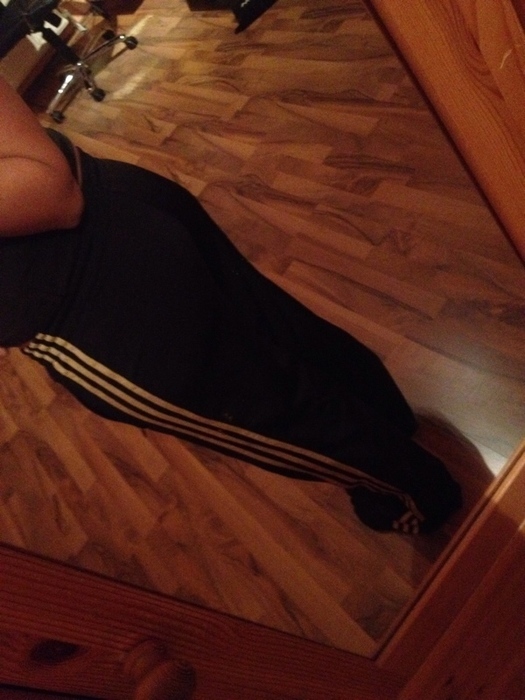 Girl in black/white Adidas pants