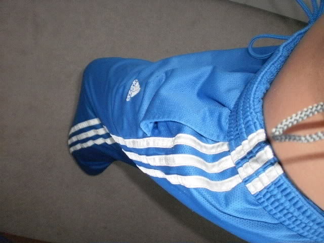 Girl in blue Adidas pants