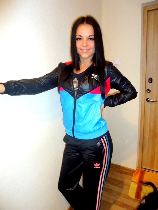 Girl in shiny adidas clothes