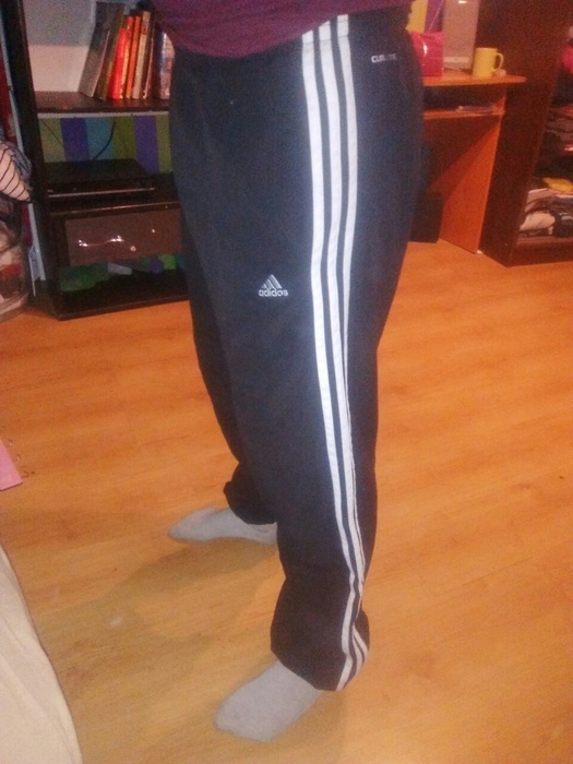 Girl with black/white adidas pants