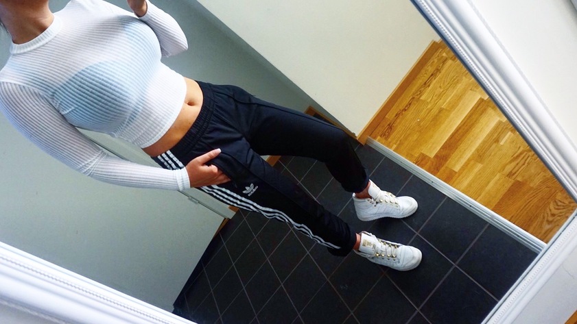 Girl with black/white adidas pants