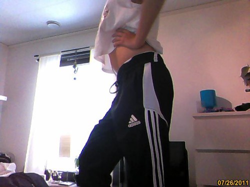 Girl with black/white adidas pants