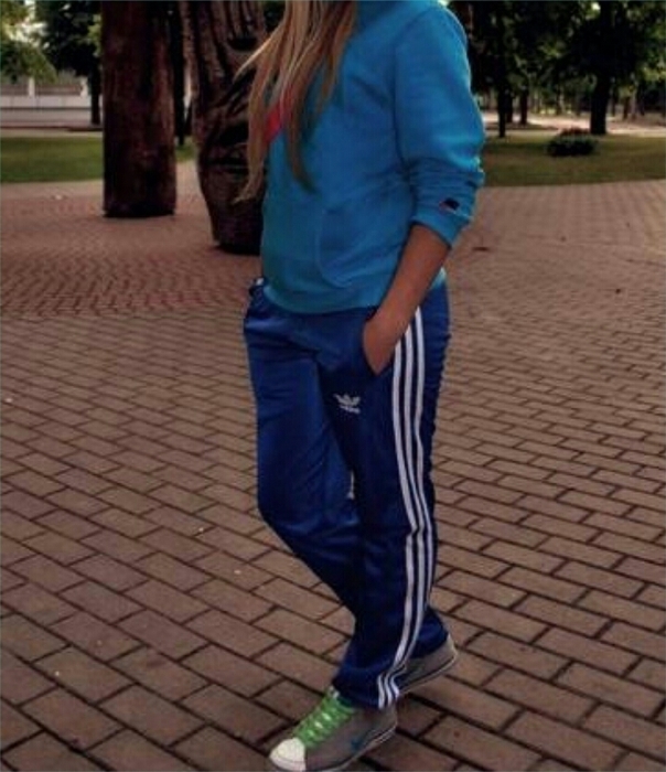 Girl with blue/white adidas pants