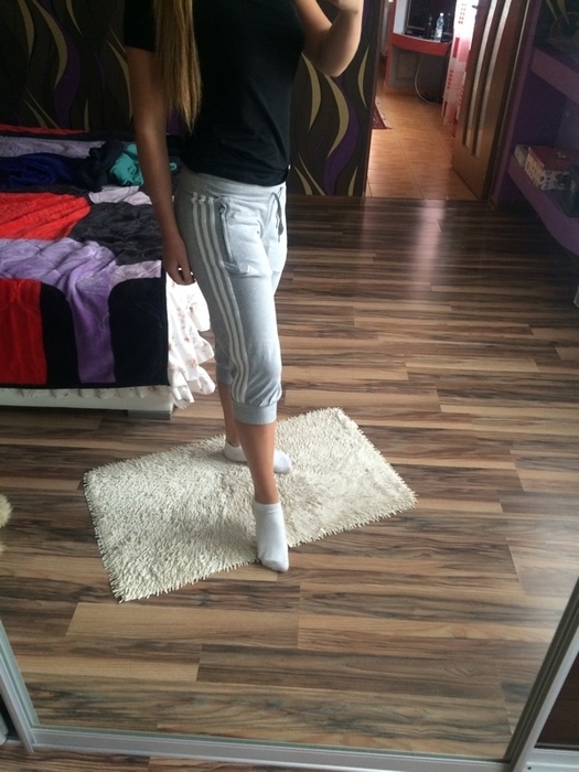 Girl with grey/white adidas pants