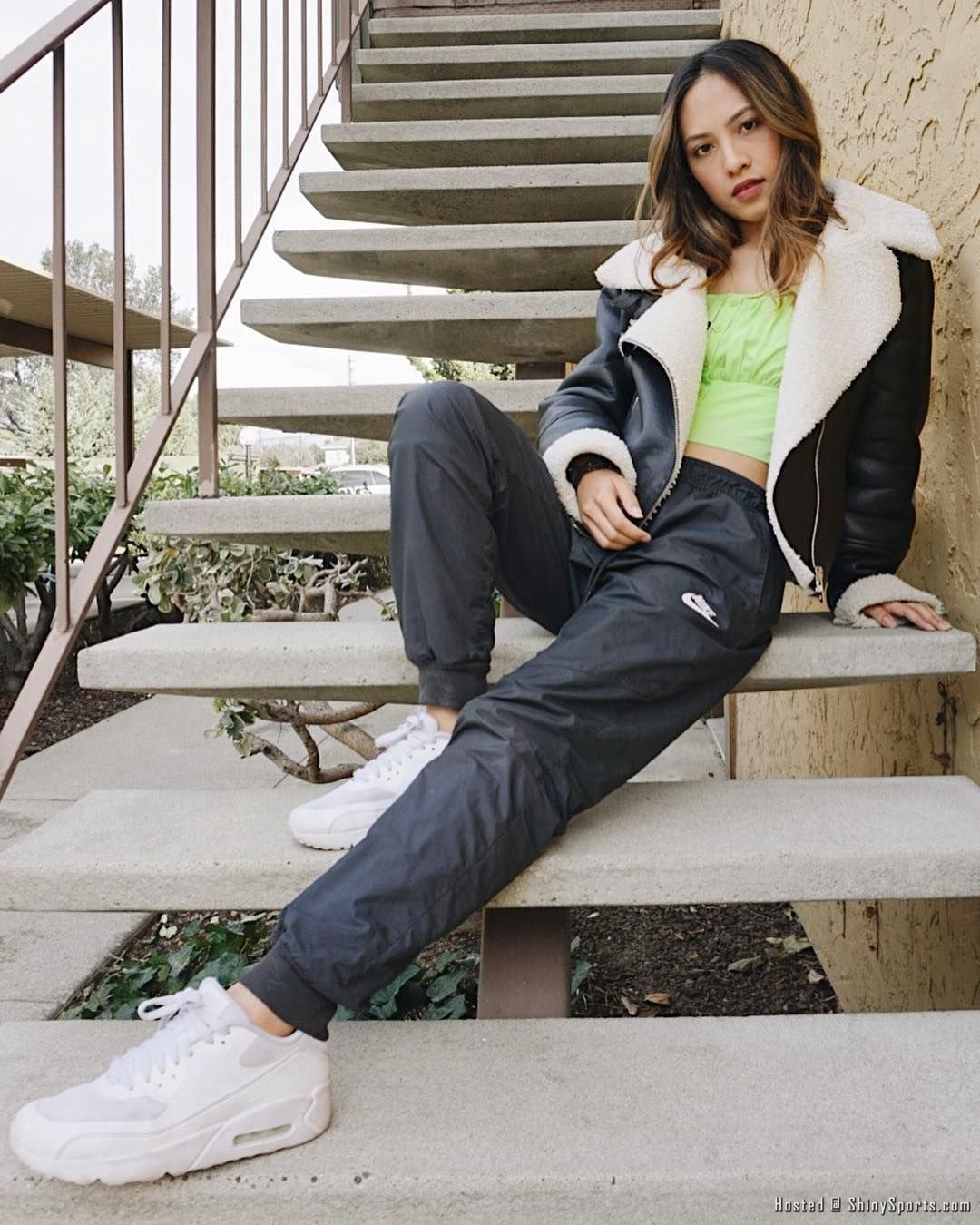 Image may contain_ 1 person, sitting, shoes and outdoor.jpg