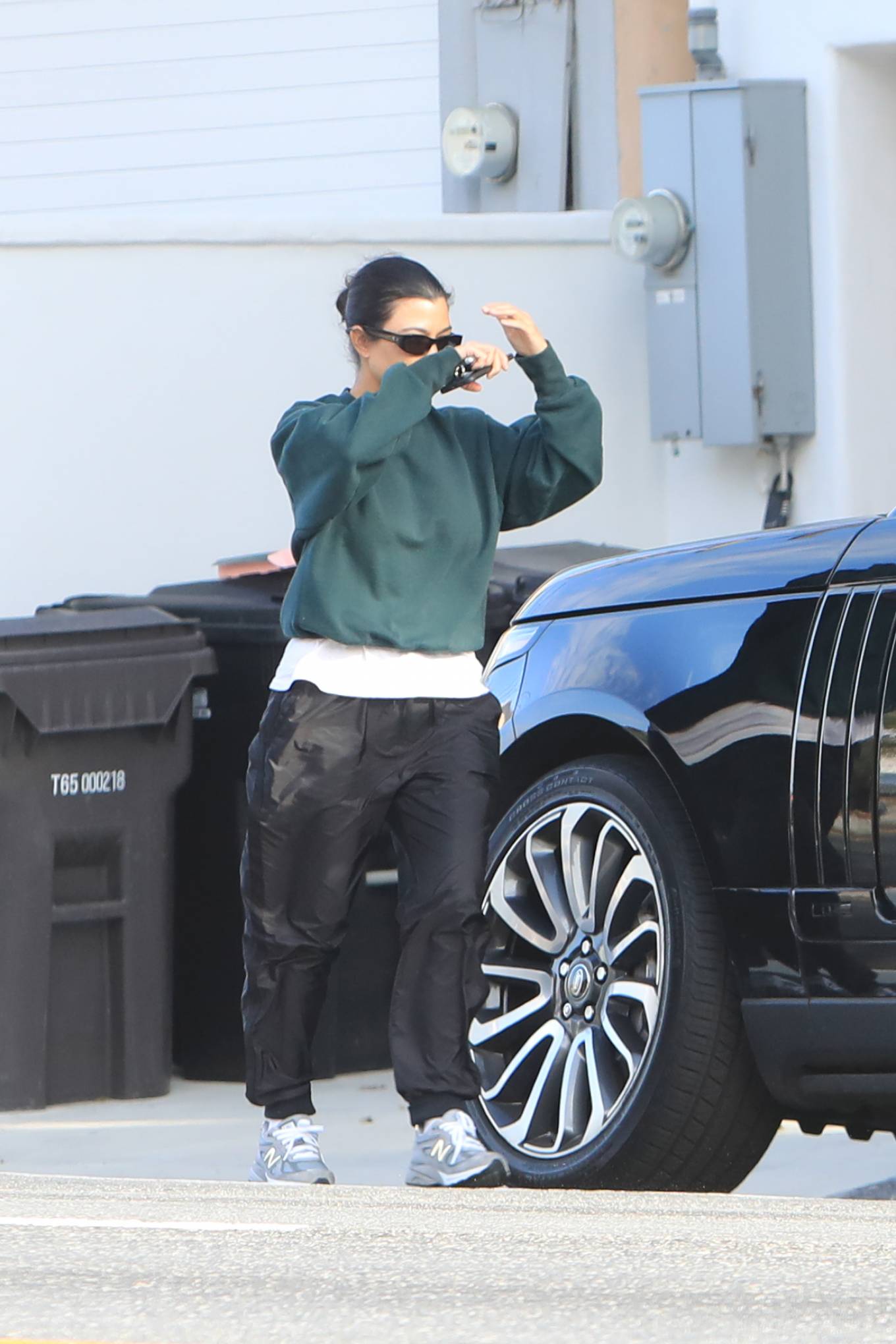 Kourtney+Kardashian-leaving+the+her+home-oversized+emerald+green+sweatshirt-grey+New+Balance+s...jpg