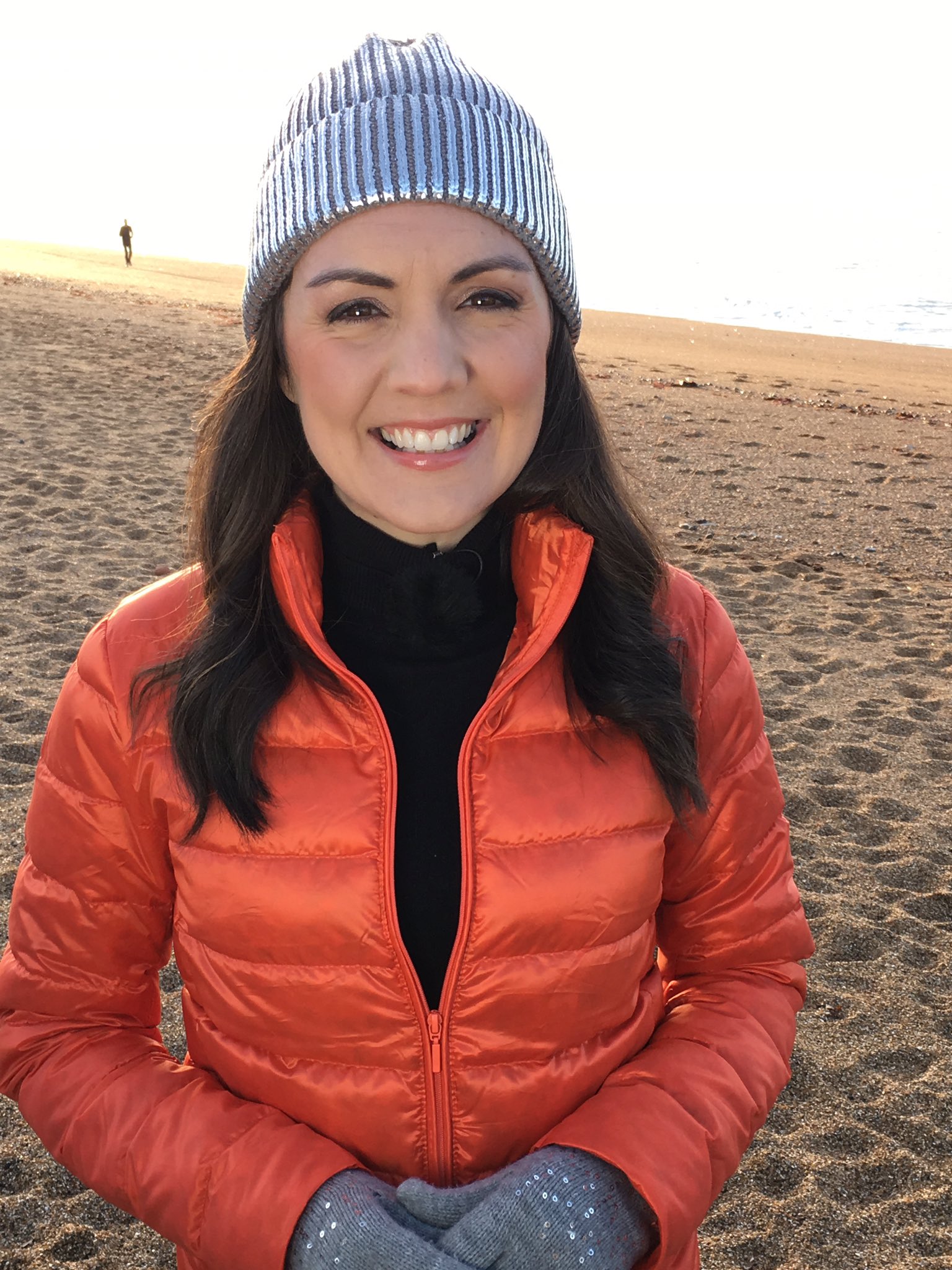 Laura Tobin orange down jacket