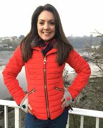 Laura Tobin red down jacket
