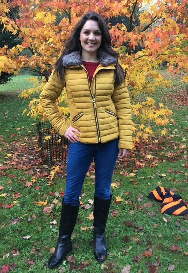 Laura Tobin yellow down jacket