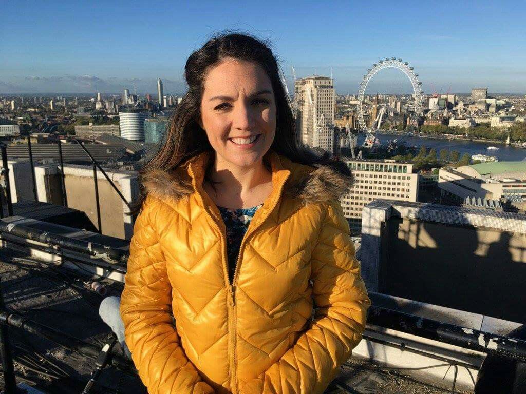 Laura Tobin yellow down jacket