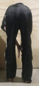 Me bending over in my Large Black GTM Sportswear Polyester Pants (farther away)