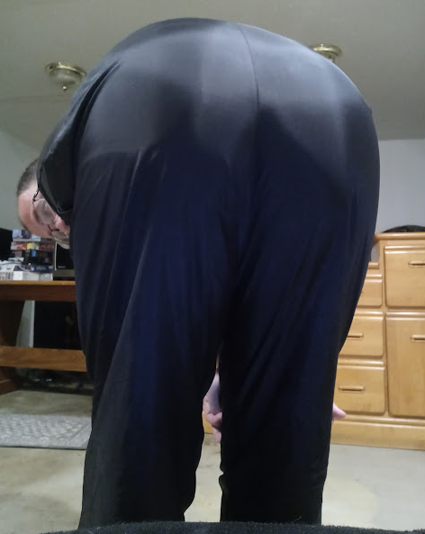 Me bending over in my Medium Black Asics Nylon Pants 1