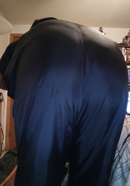 Me bending over in my Medium Black Asics Nylon Pants 3