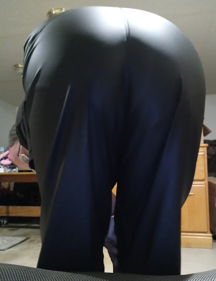 Me bending over in my Medium Black Helly Hansen Polyester Pants (close-up)