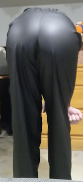 Me bending over in my Medium Black Helly Hansen Polyester Pants (farther away)