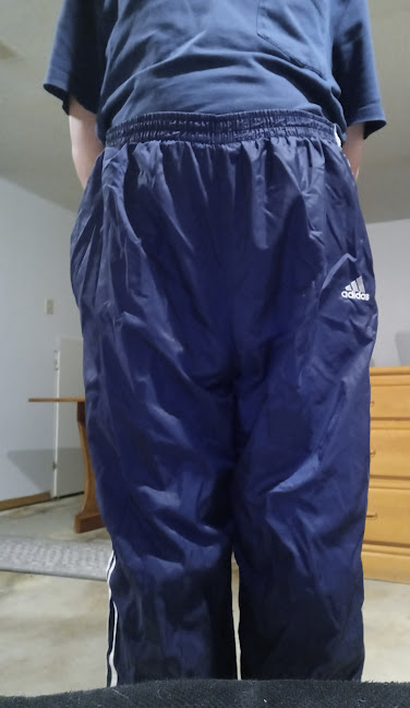 Me in my Dark Blue Adidas Nylon Pants with my hands behind my back 1