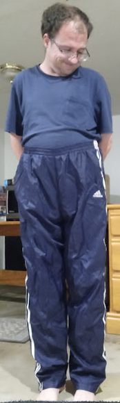 Me in my Dark Blue Adidas Nylon Pants with my hands behind my back 2