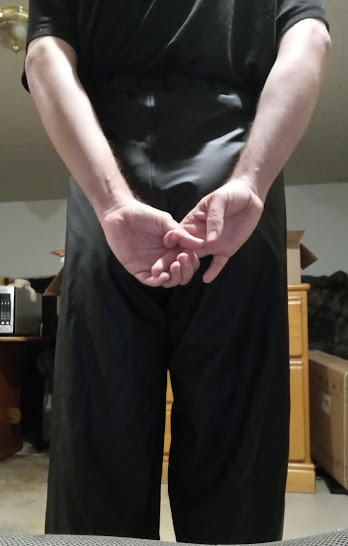 Me in my Medium Black Helly Hansen Polyester Pants w/my hands behind my back (back, close-up)