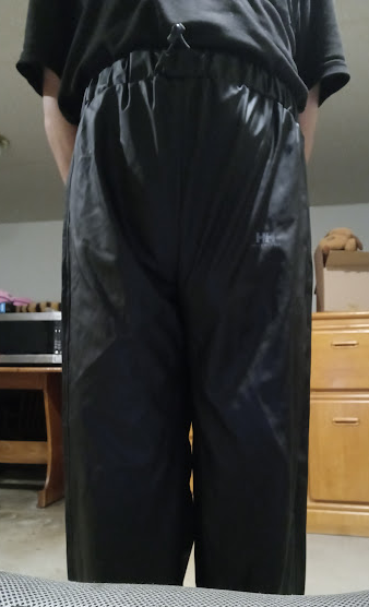 Me in my Medium Black Helly Hansen Polyester Pants w/my hands behind my back (front, close-up)