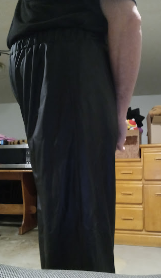 Me in my Medium Black Helly Hansen Polyester Pants w/my hands behind my back (side 1, close-up)