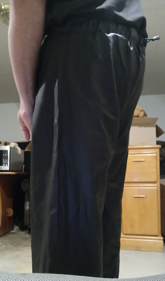 Me in my Medium Black Helly Hansen Polyester Pants w/my hands behind my back (side 2, close-up)